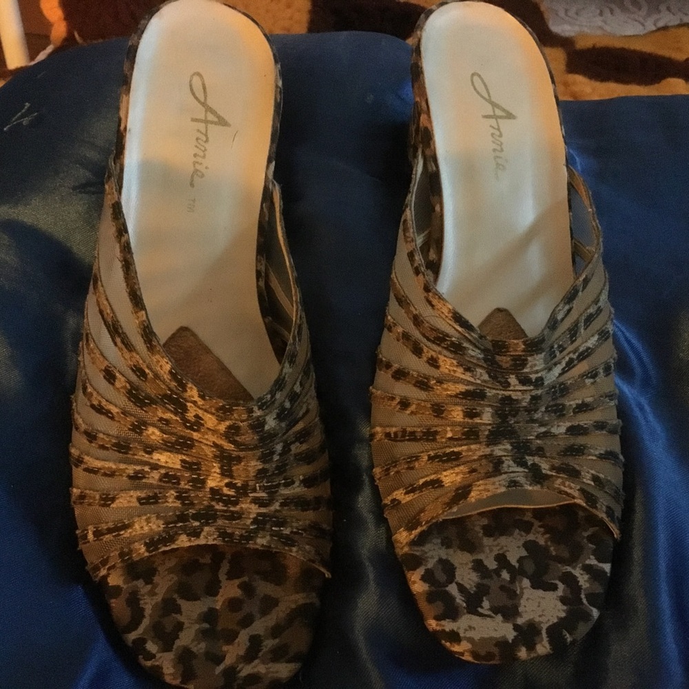 Heeled open-toe mule style shoes.